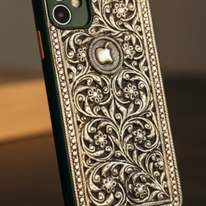 Silver mobile cover with intricate engraved floral and minimalistic design, premium metallic finish luxury phone case for iPhone showcasing detailed handcrafted artwork and elegant silver texture.