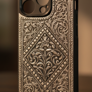 Silver mobile cover with intricate engraved floral and royal artwork design, premium metallic finish luxury phone case for iPhone showcasing detailed handcrafted artwork and elegant silver texture.