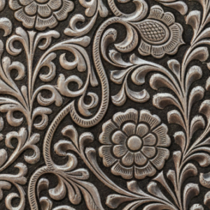 Silver mobile cover showcasing detailed handcrafted artwork and elegant silver texture.
