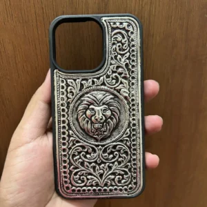 Silver mobile cover with intricate engraved floral and lion face design, premium metallic finish luxury phone case for iPhone showcasing detailed handcrafted artwork and elegant silver texture.